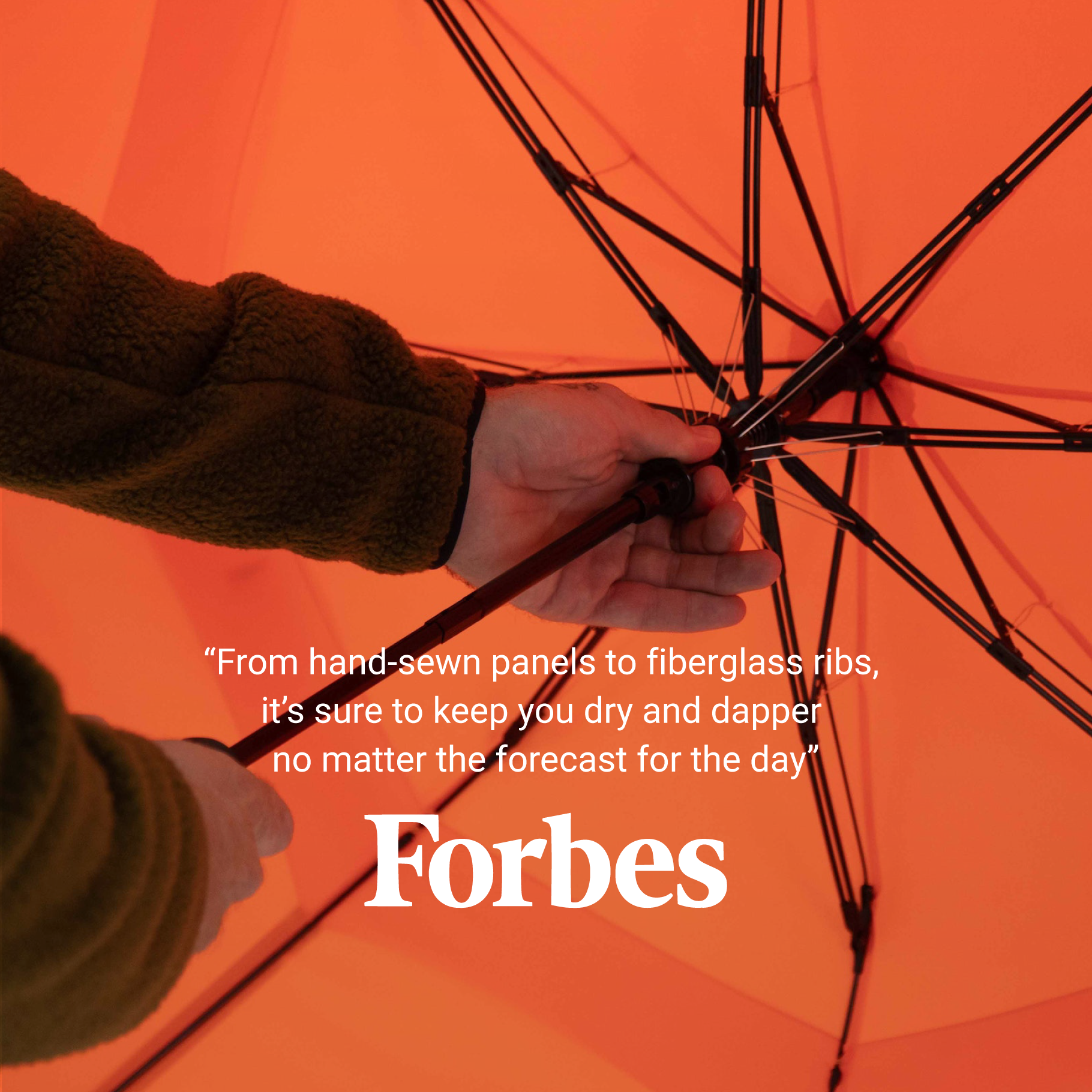 Weatherman Stick Umbrella in orange with Forbes quote.