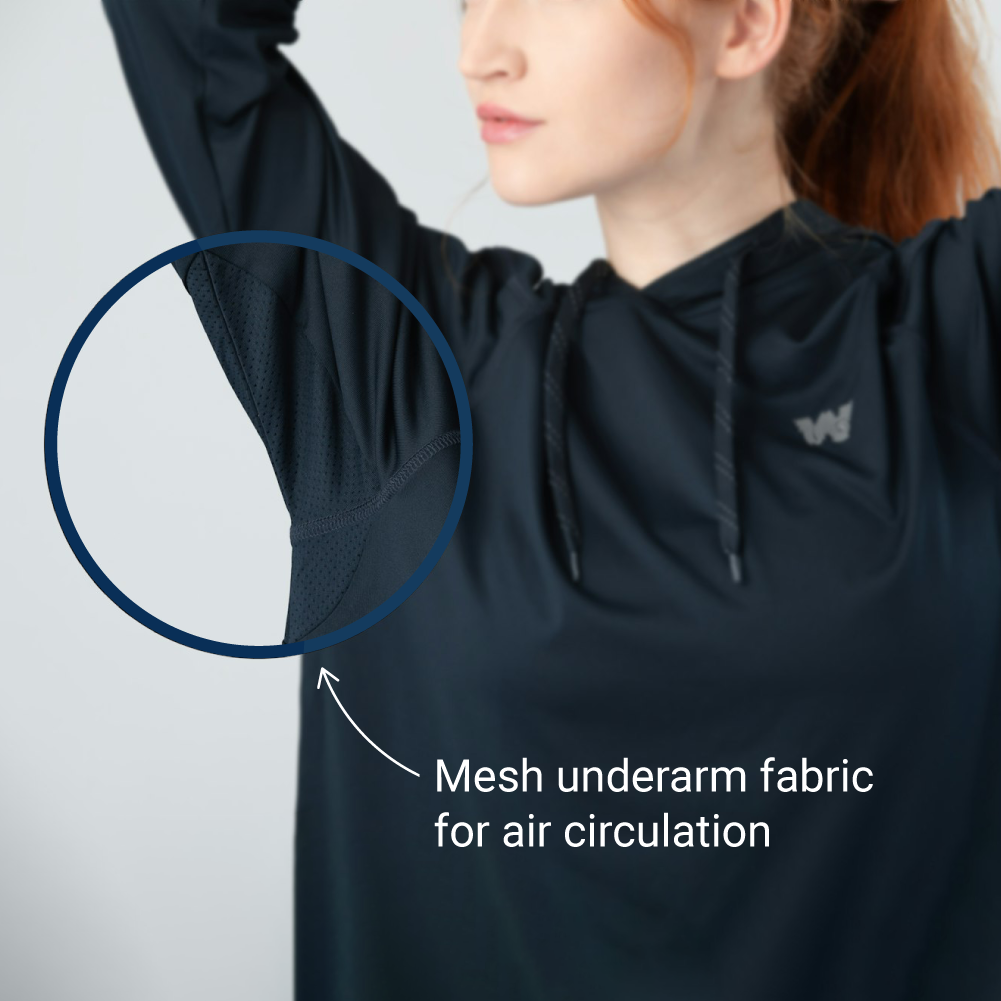 Woman wearing Weatherman Sun Shirt in midnight blue with mesh underarm fabric feature. 